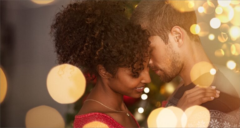 Attractive couple close to each other with bokeh background
