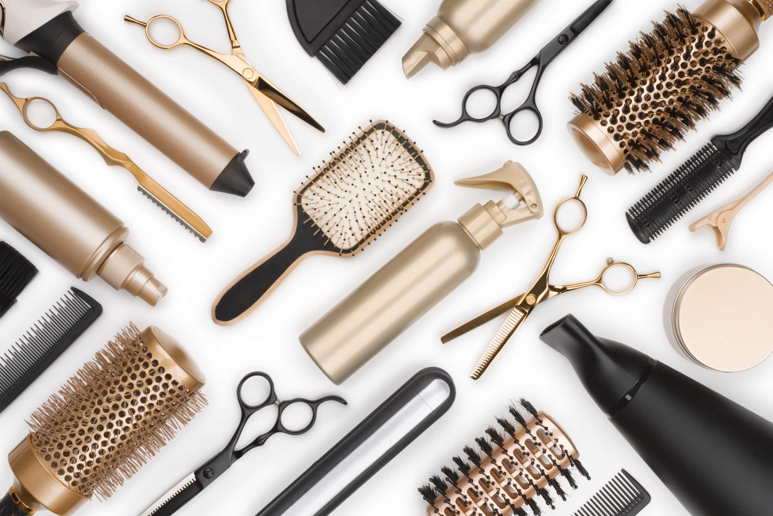 Full frame of professional hair dresser tools on white background