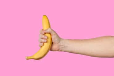 Man's Hand Holding a Banana