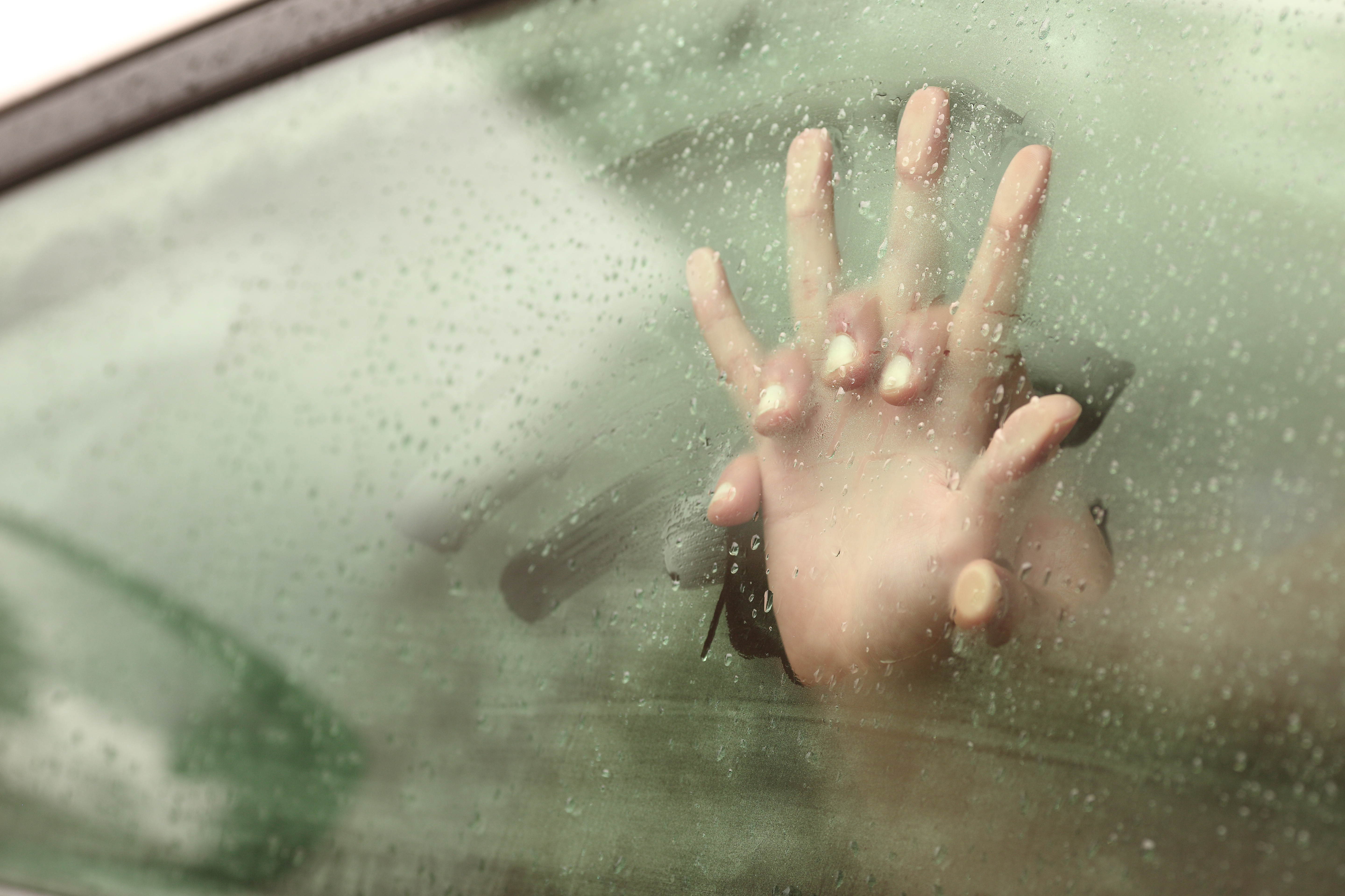 Hands on A Steamy Car Window