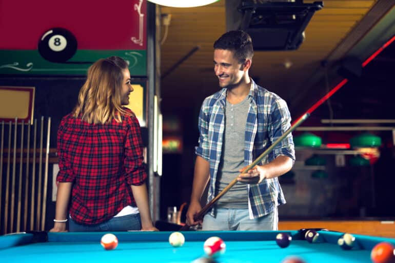 Couple,Dating,,Flirting,And,Playing,Billiard,In,A,Pool,Hall