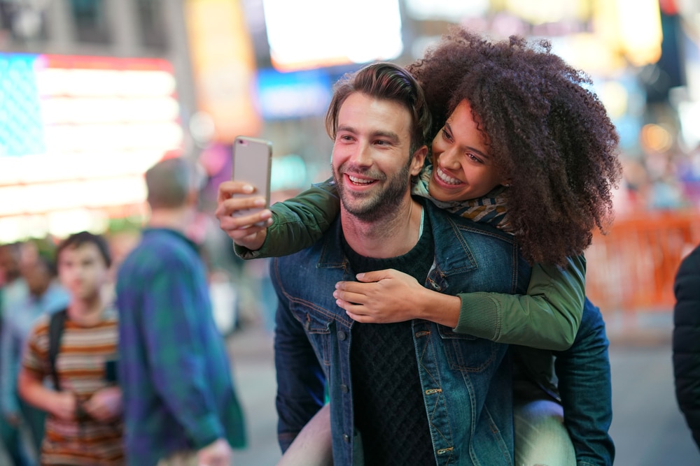 Couple,At,Times,Square,Taking,Selfie,Picture