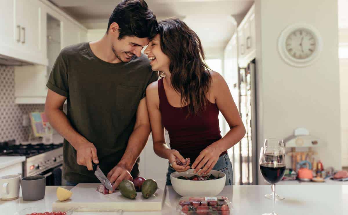 Couple prepares romantic dinner at home