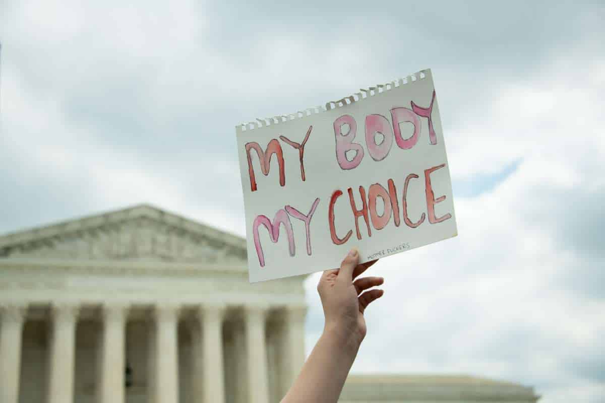 A hand holds up a "My Body My Choice" sign during a US protest